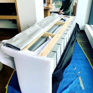 couch movers disassemble white couch